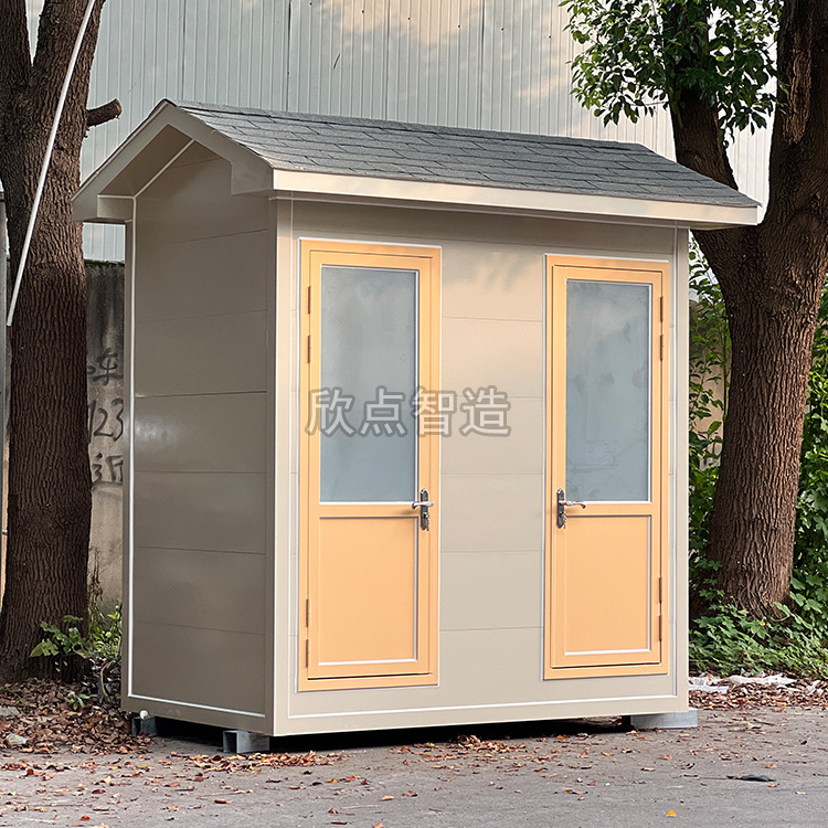 Two outdoor bathrooms in the public toilet area of the portable metal sculpture.