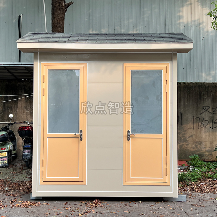 Two outdoor bathrooms in the public toilet area of the portable metal sculpture.