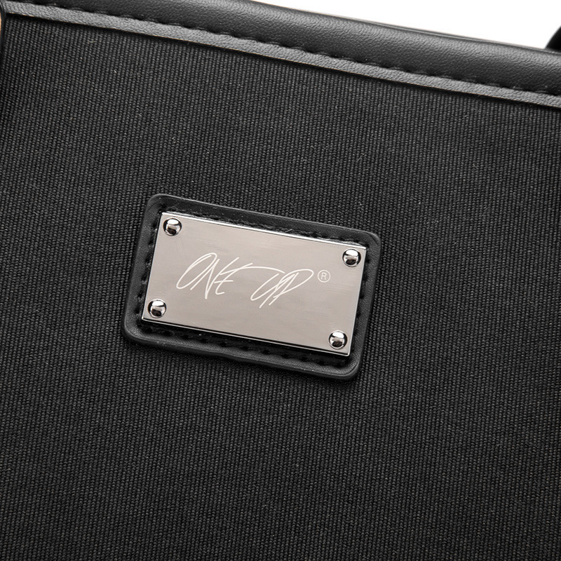 The new man's handbag, the Oxford briefcase, is customised to logo.