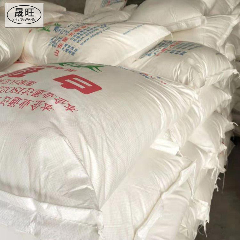 A large bag of white sugar in bulk with sugar powdered food in a white bakery.