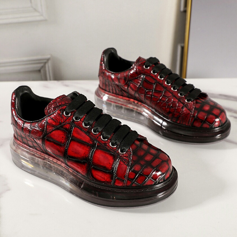 A man with one shoe and a single gator's belly in a oxen-skin McQueen.