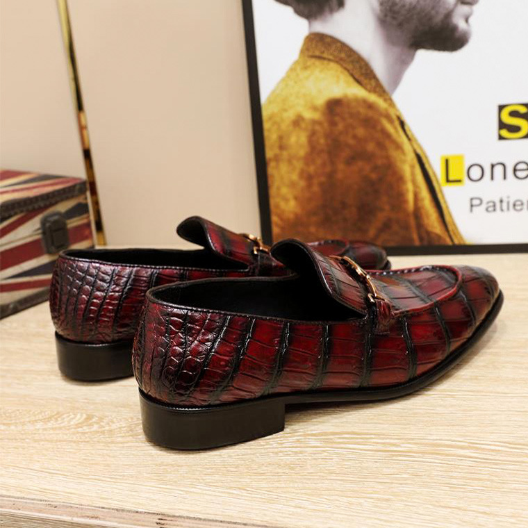 The bean shoes are hand-carrying the gator's belly is sore.
