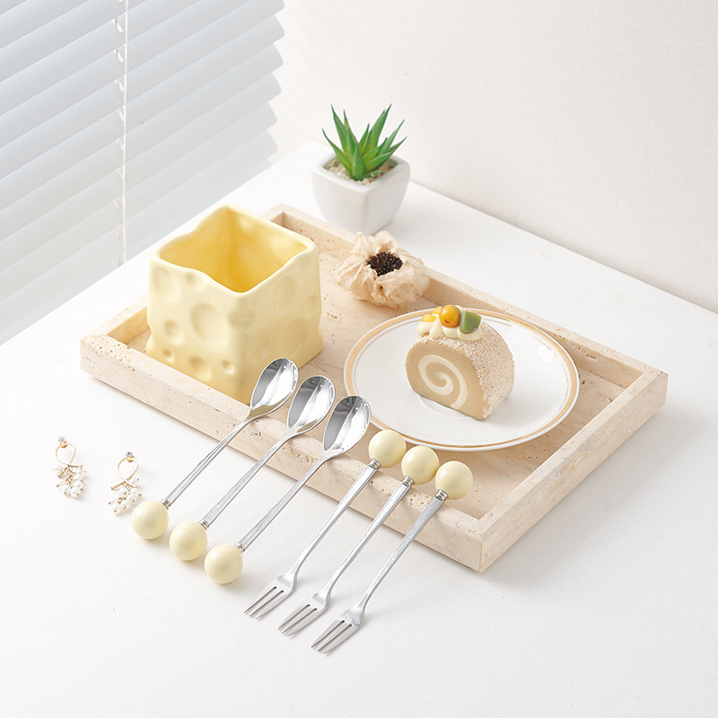 A new creamed, porcelain and fork cans of creative cheese and cans of cylindrical fruit fork.