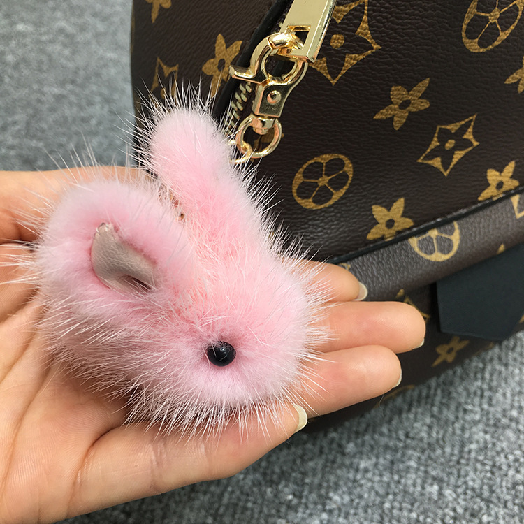 A cute mink furry little jade rabbit lard with dead fur rabbit bag keys to rabbit jewelry.