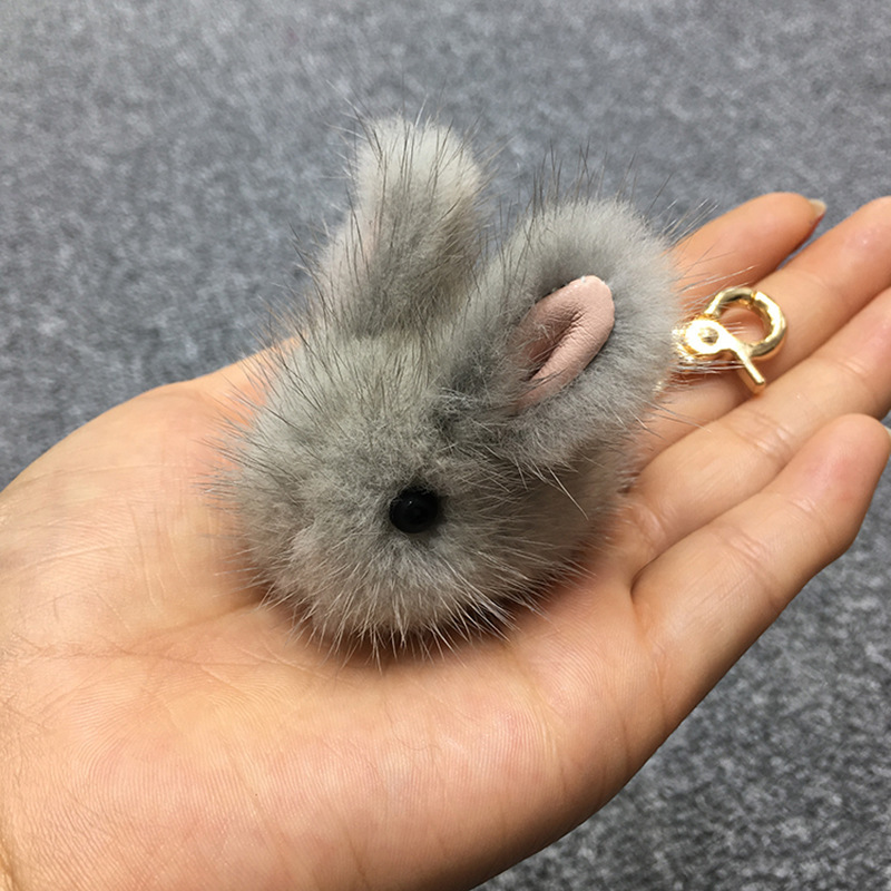 A cute mink furry little jade rabbit lard with dead fur rabbit bag keys to rabbit jewelry.