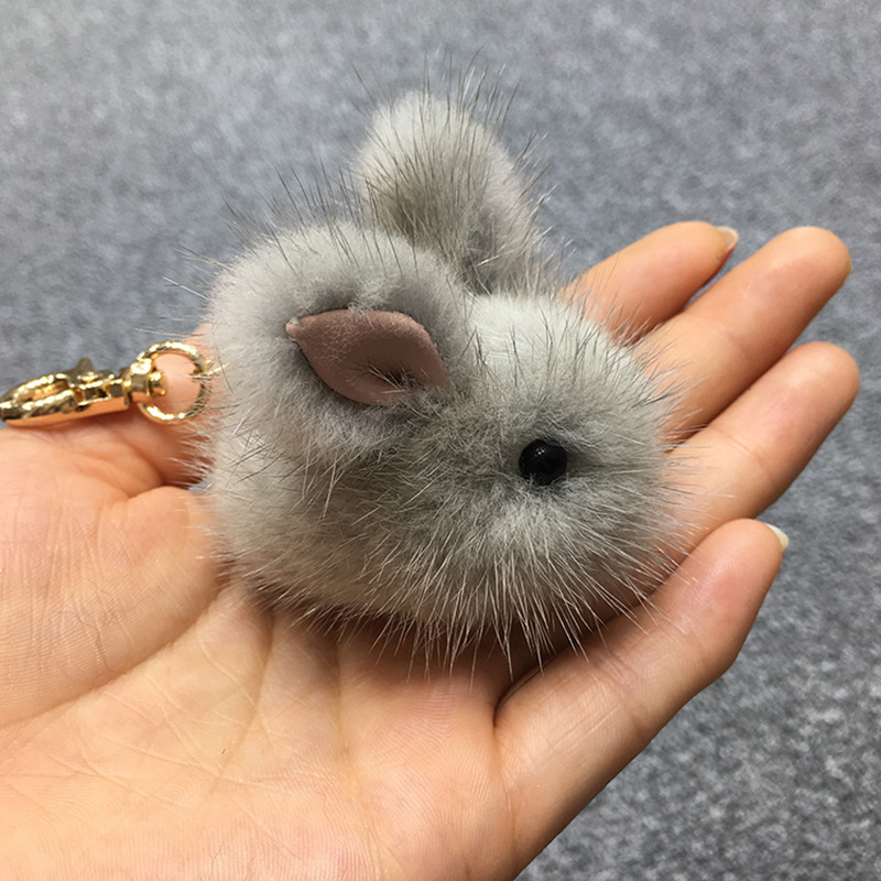 A cute mink furry little jade rabbit lard with dead fur rabbit bag keys to rabbit jewelry.