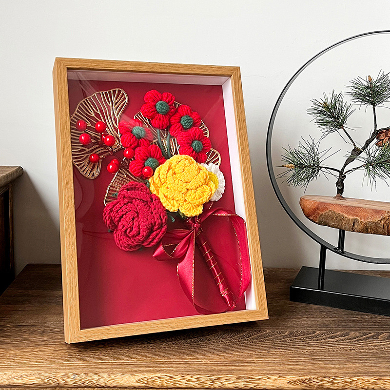 A hand-made crocheted bouquet of roses sends a girlfriend's birthday present to the sunflower home-made crochet flower.