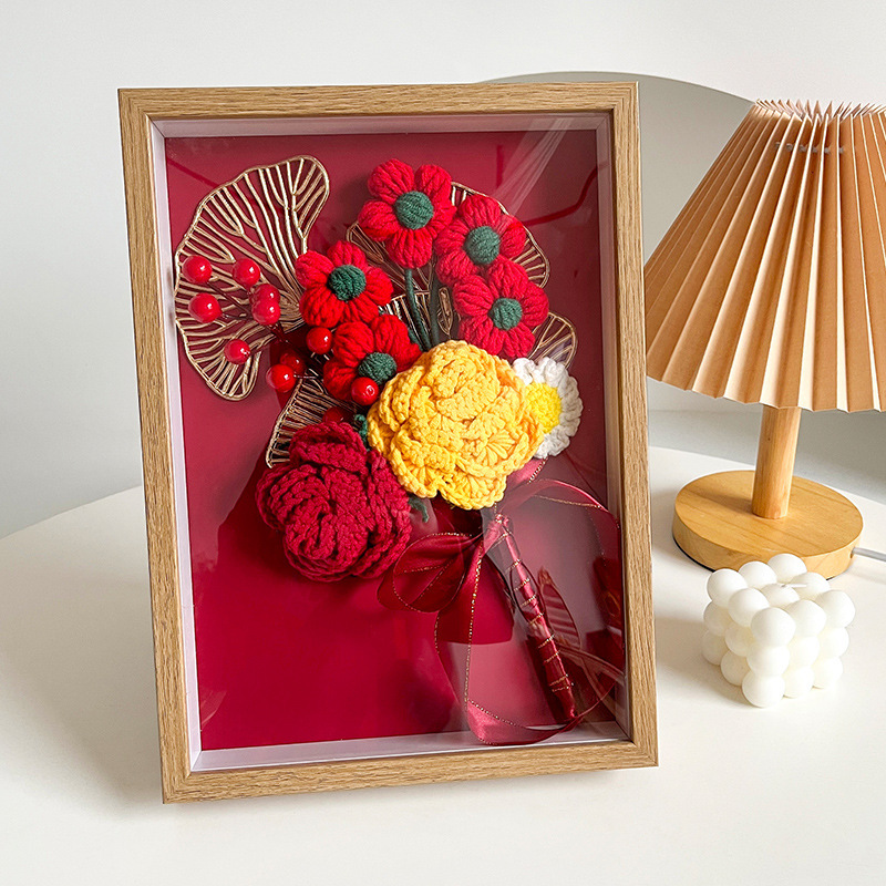 A hand-made crocheted bouquet of roses sends a girlfriend's birthday present to the sunflower home-made crochet flower.