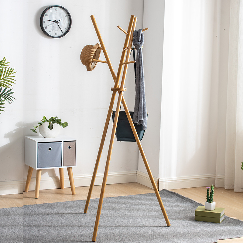 Folding of a wooden hooded bedroom hanger with a simple modern living room and a simple home-made dress rack