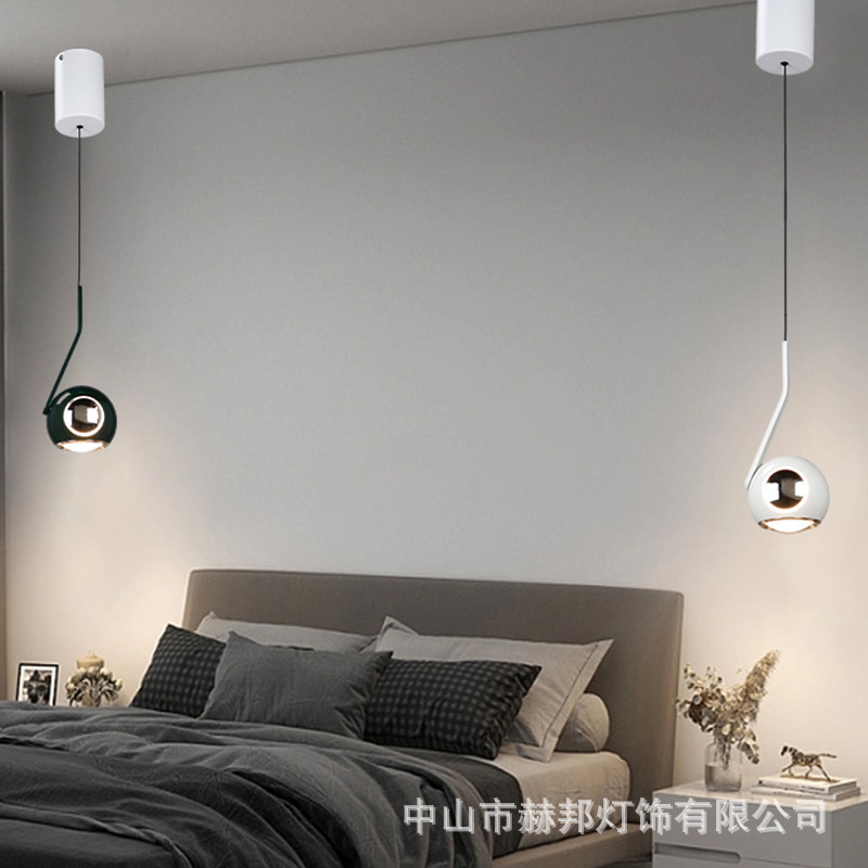 The small red chandelier on the head of the Nordic chandelier bed is a modern, simple, single-headed chandelier chandelier.