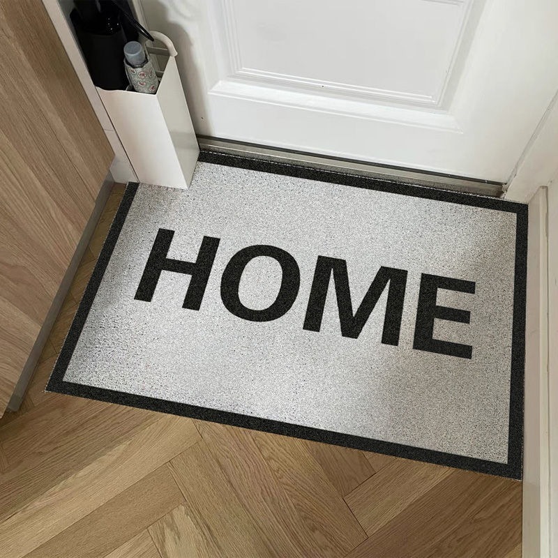 Red HOME black-and-white mats, home bathroom sliding pads, door scratching the sand-clad carpet.