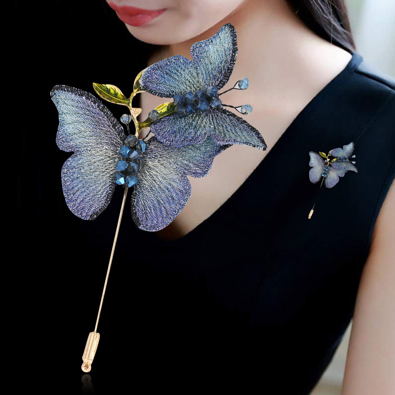 Japanese and Korean embroidered butterflies with their spring jackets and pins on their shirts.